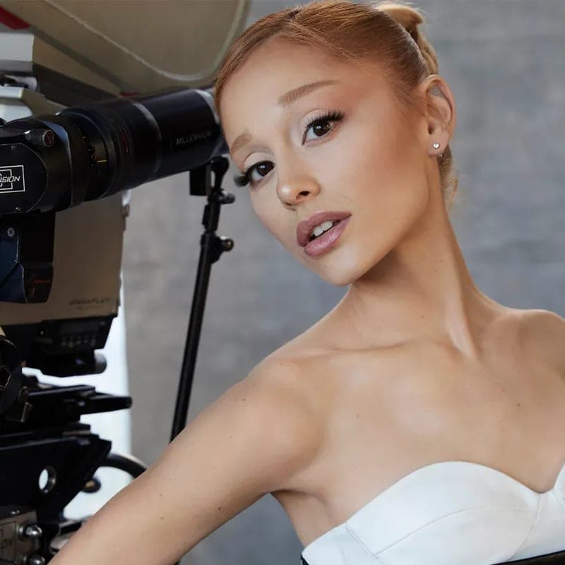 Ariana Grande beside a film camera